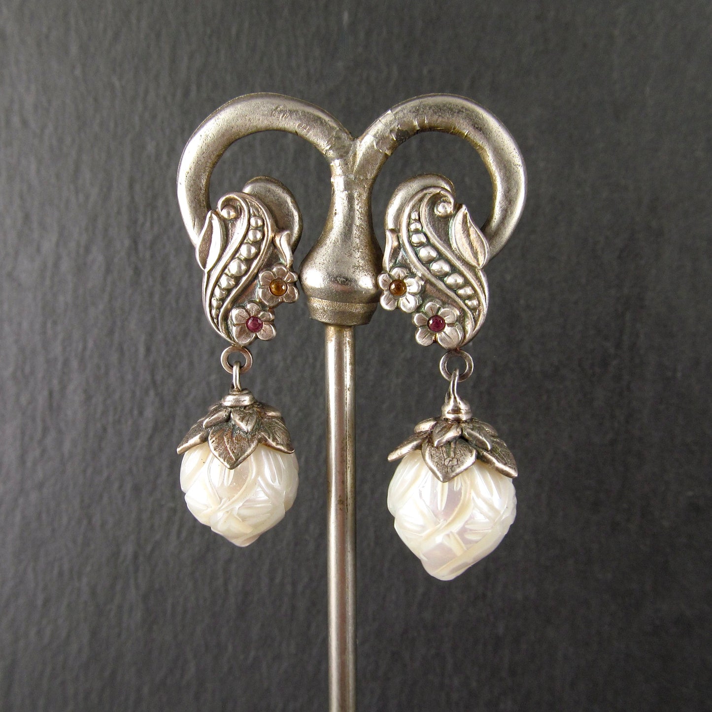 Carved pearl flower bud earrings in fine silver with pastel sapphires