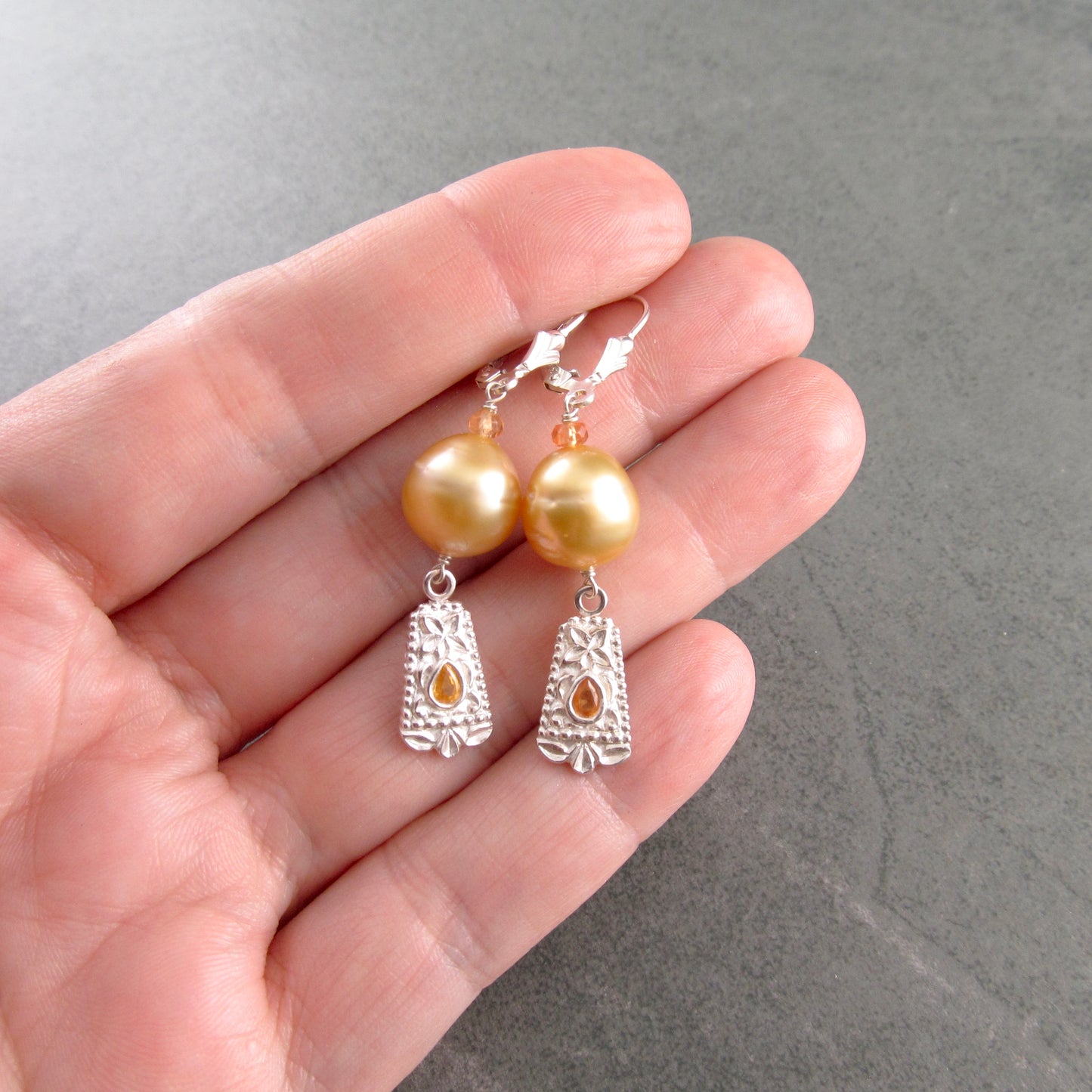 Gold South Sea pearl earrings with orange sapphire in fine silver