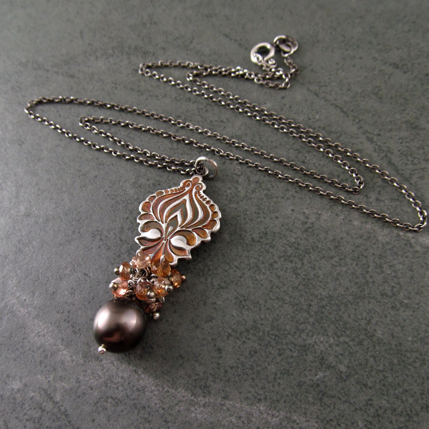 Mocha Tahitian Pearl pendant in fine silver with color change garnets