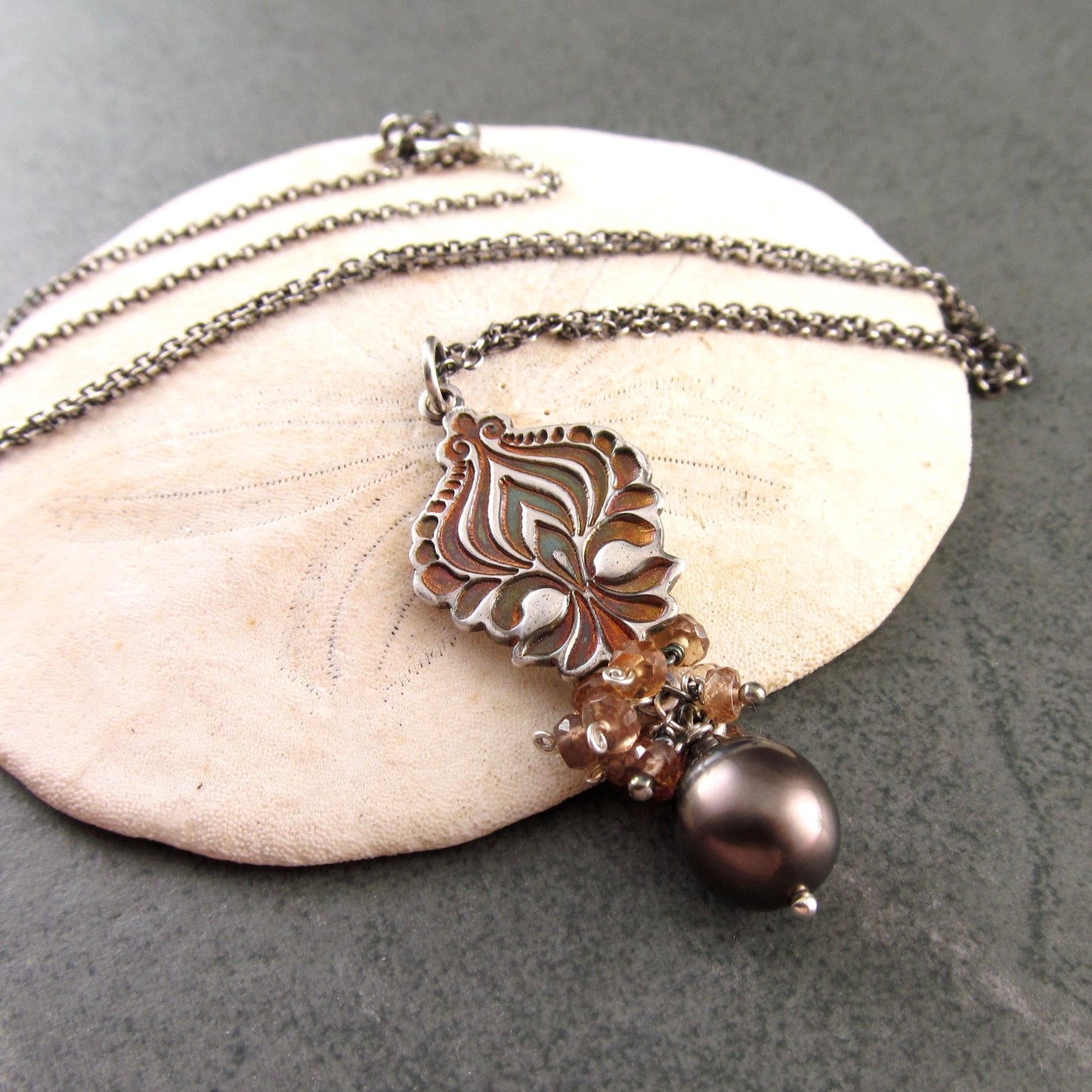Mocha Tahitian Pearl pendant in fine silver with color change garnets