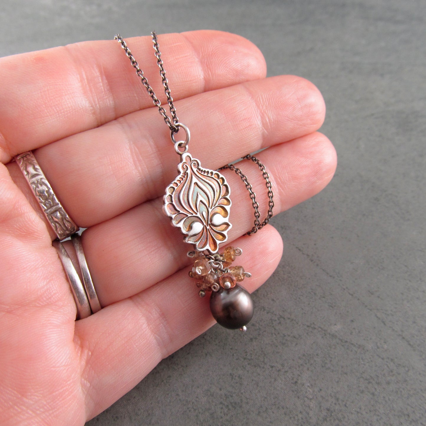 Mocha Tahitian Pearl pendant in fine silver with color change garnets