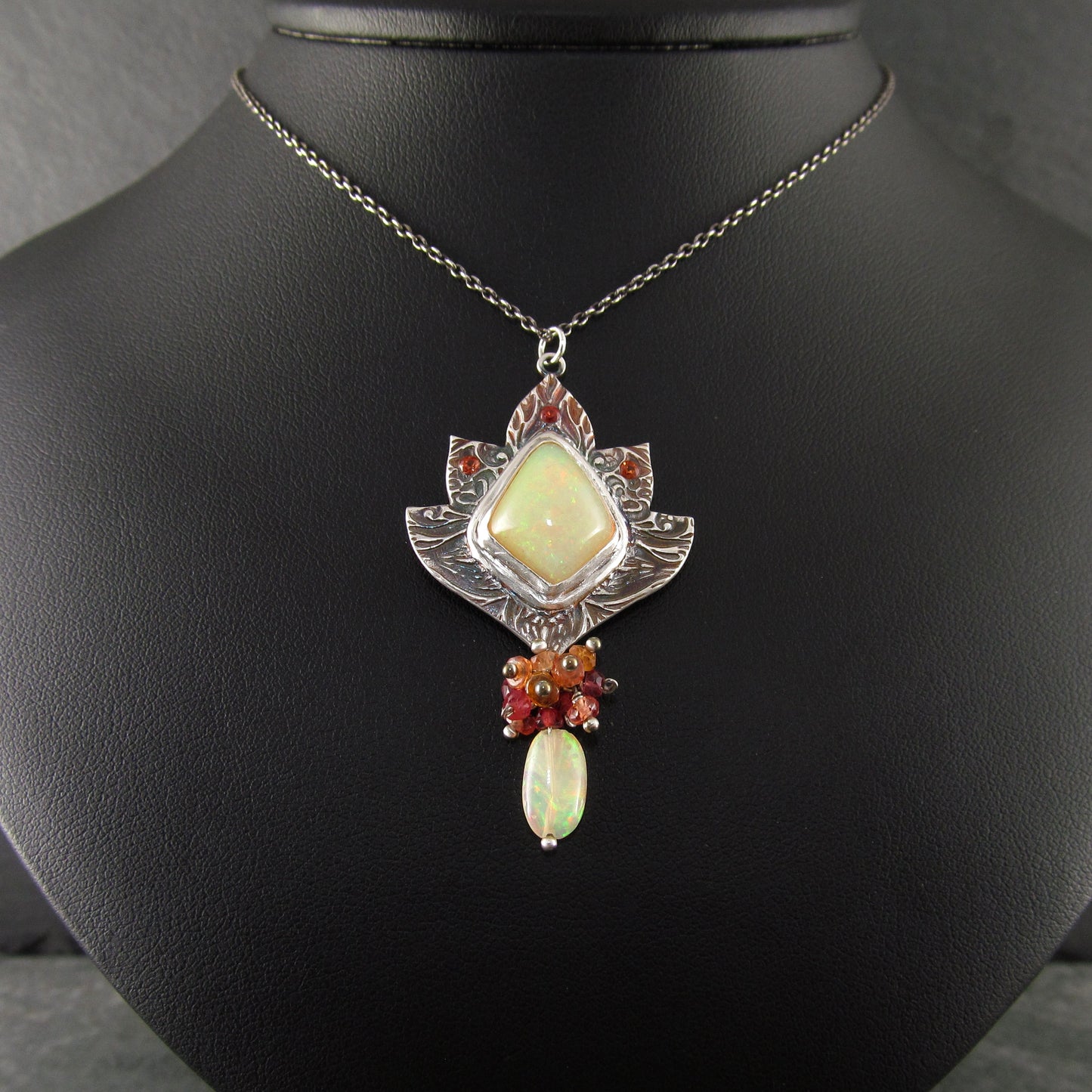 Ethiopian opal pendant with orange and red sapphires