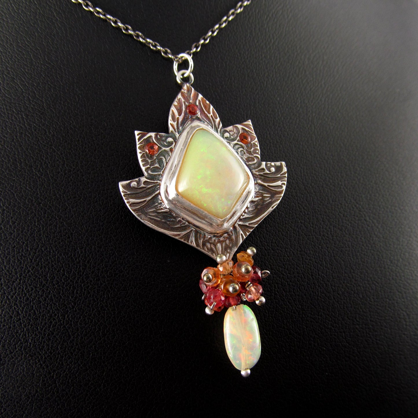 Ethiopian opal pendant with orange and red sapphires