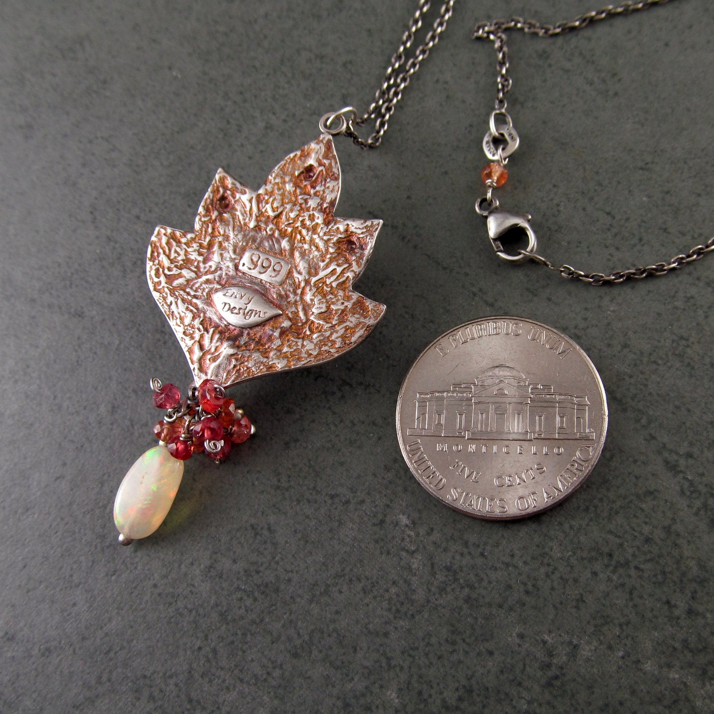 Ethiopian opal pendant with orange and red sapphires