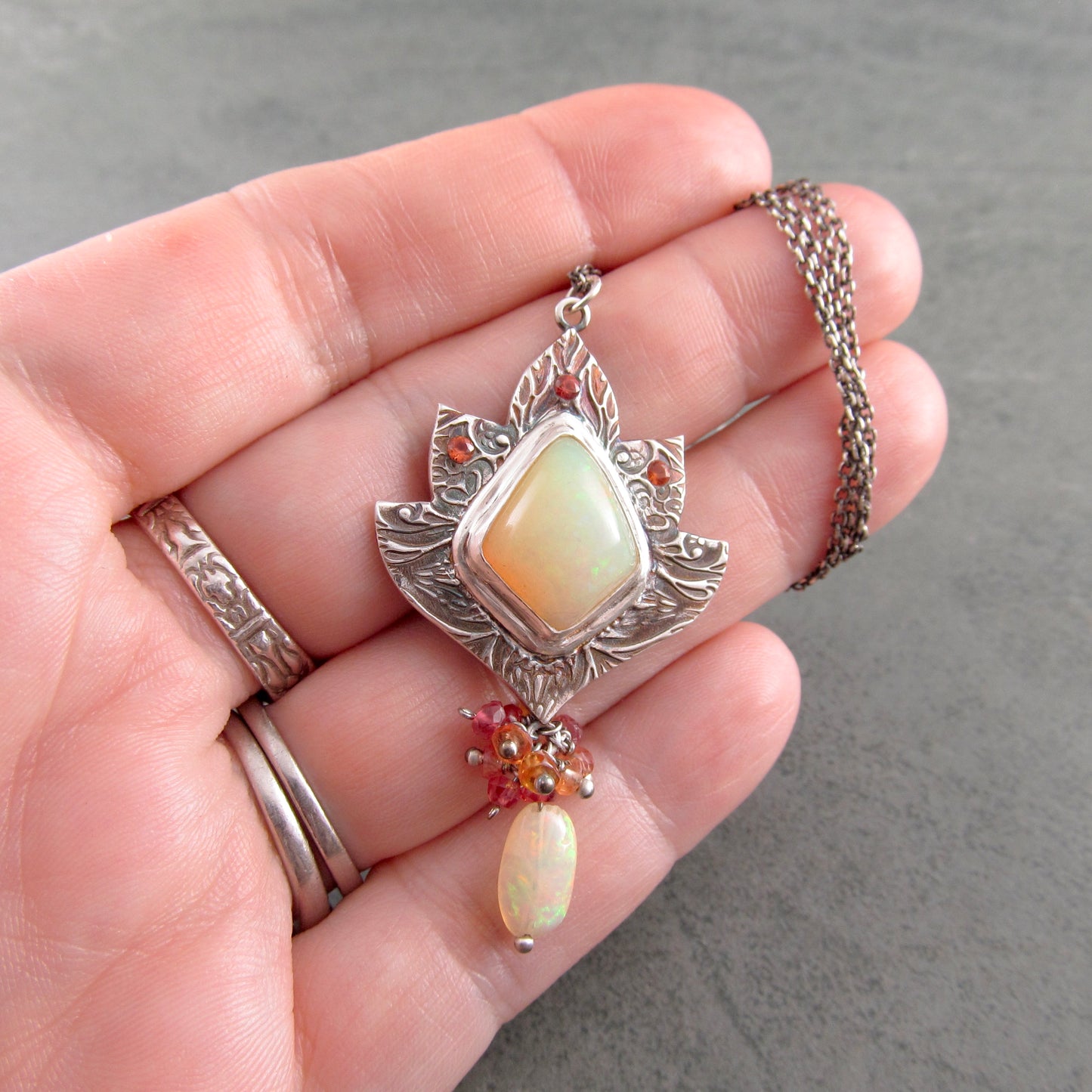 Ethiopian opal pendant with orange and red sapphires