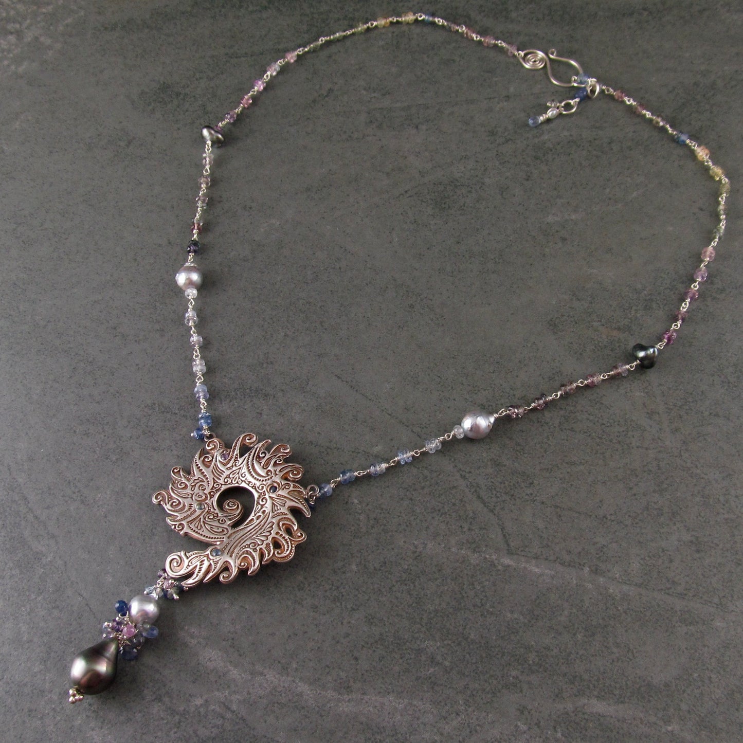 Ocean blue spiral shell fine silver pendant with sapphire and Tahitian and Akoya pearls