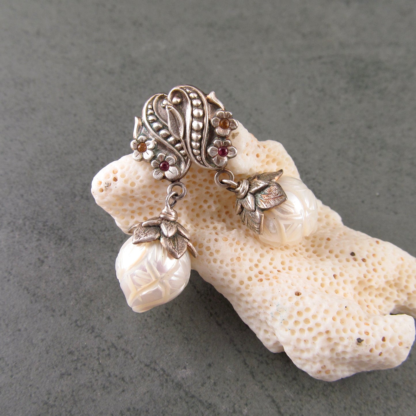 Carved pearl flower bud earrings in fine silver with pastel sapphires